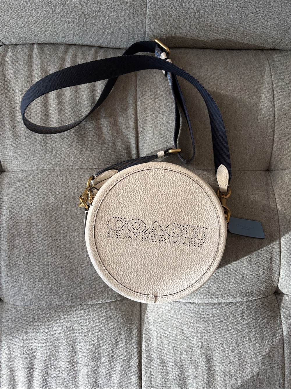 COACH Cream Round Pebbled Leather Crossbody with Black Strap